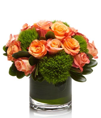 A cute arrangement of Coral and Peach Roses- H.Bloom