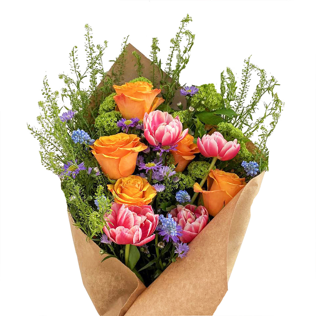 A lively bundle of blooms such as roses, hydrangea, and tulips.