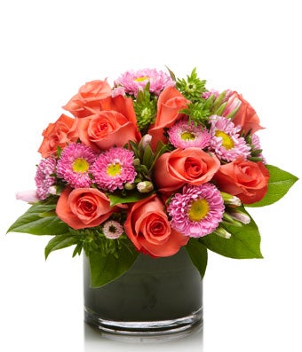 A fun arrangement of Coral Roses and Pink Matsumoto Aster- H.Bloom