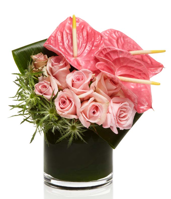 A luxury all pink arrangement with roses and orchids