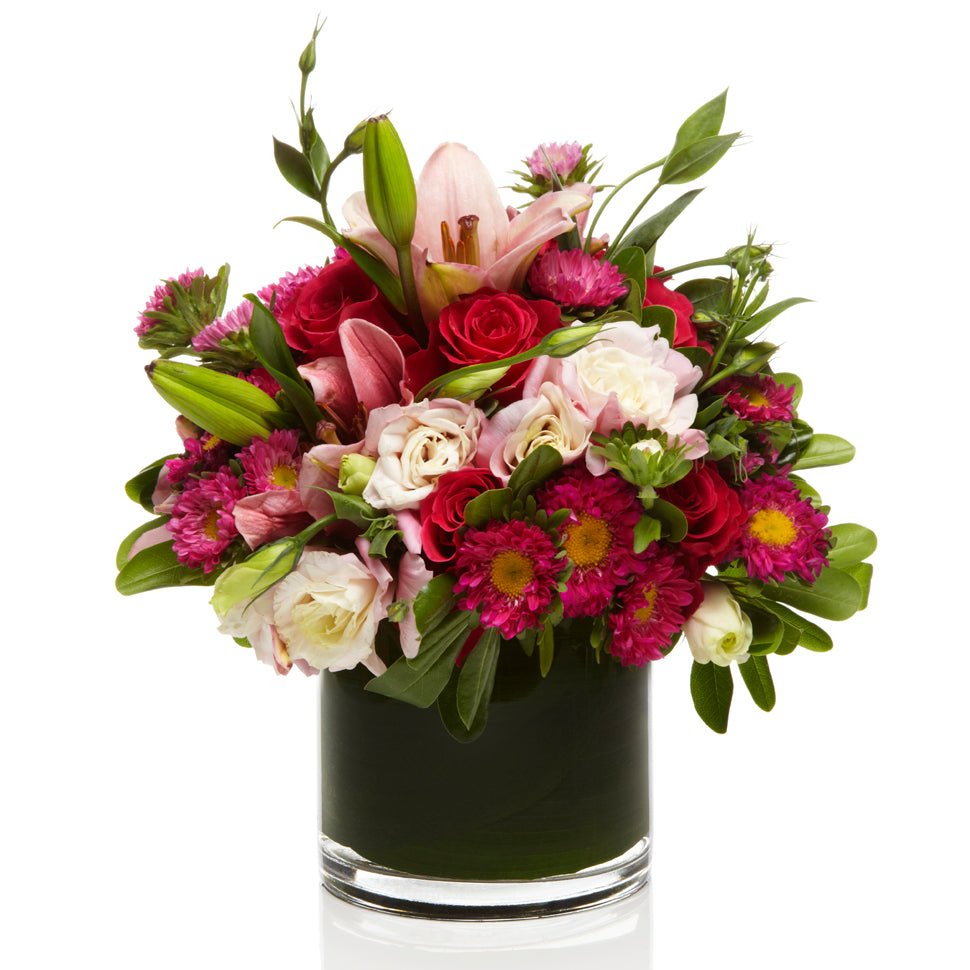 A cute arrangement of Pink Lilies, Aster and Roses - H.Bloom