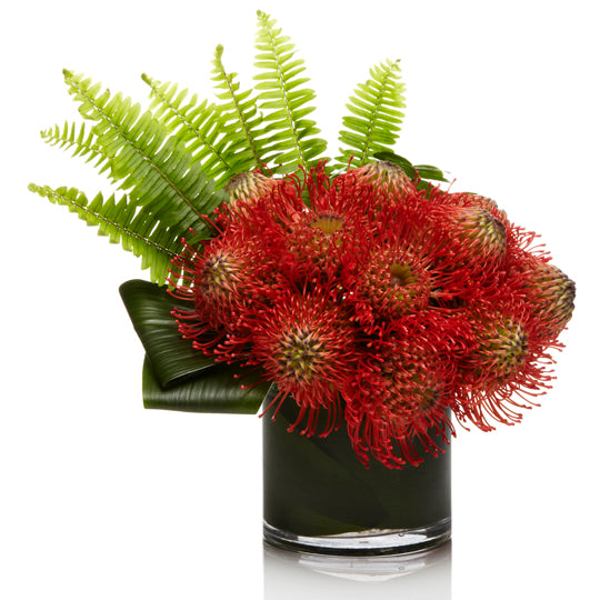 An Arrangement of Red and Orange Pincushion Protea with Tropical Greens- H.Bloom