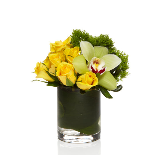 A cute arrangement of Green Dianthus, Yellow Roses and Green Orchids - H.Bloom